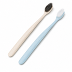 Angled head disposable hotel toothbrushes with soft bristles on white background