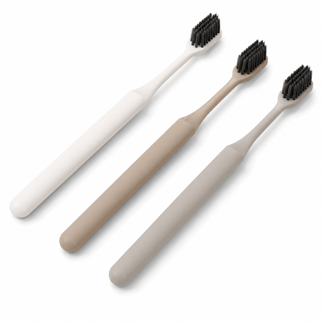 White beige and grey bamboo leaf design hotel toothbrushes on white background