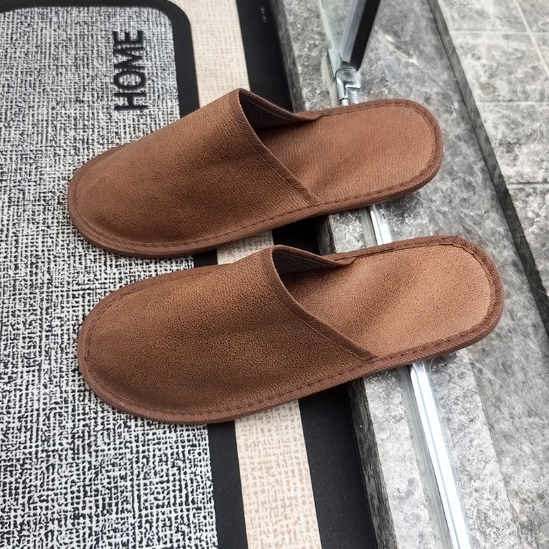 brown hospitality slippers placed on floor anti-slip sole guest room use hotel supply