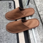 brown hospitality slippers placed on floor anti-slip sole guest room use hotel supply