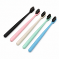 Eco-friendly hotel toothbrushes in multiple colors with soft charcoal bristles