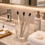 Luxury hotel toothbrushes displayed in a modern bathroom hospitality setting