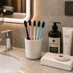 Eco-friendly hotel toothbrushes displayed in a luxury hotel bathroom