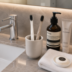 Luxury hotel toothbrushes displayed in a modern hotel bathroom setting