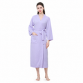 Female model wearing light purple waffle bathrobe